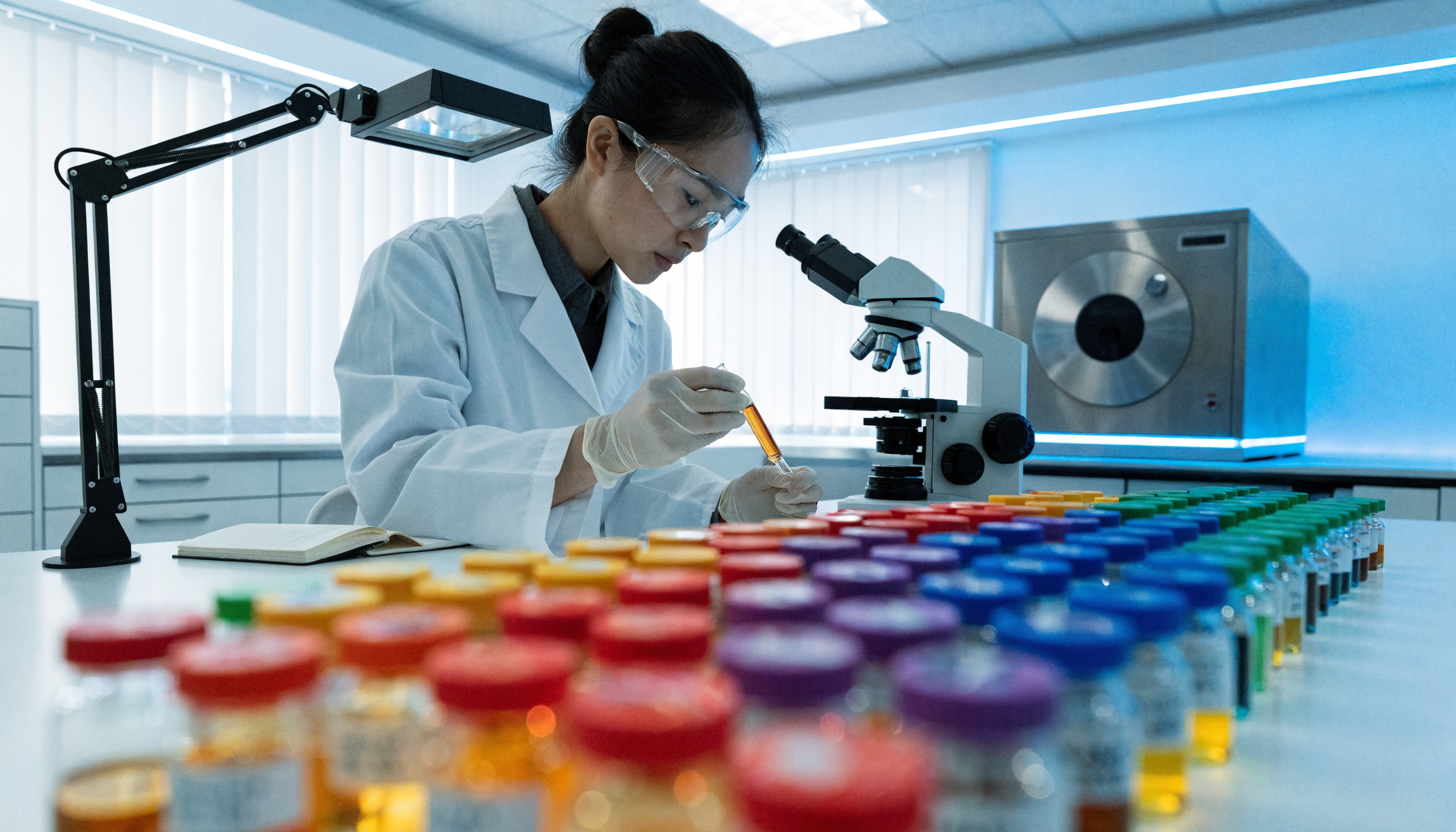 Research laboratory with peptide vials and scientific equipment — professional pharmaceutical research setting